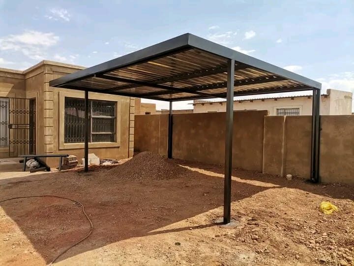 Steel carport beside a house